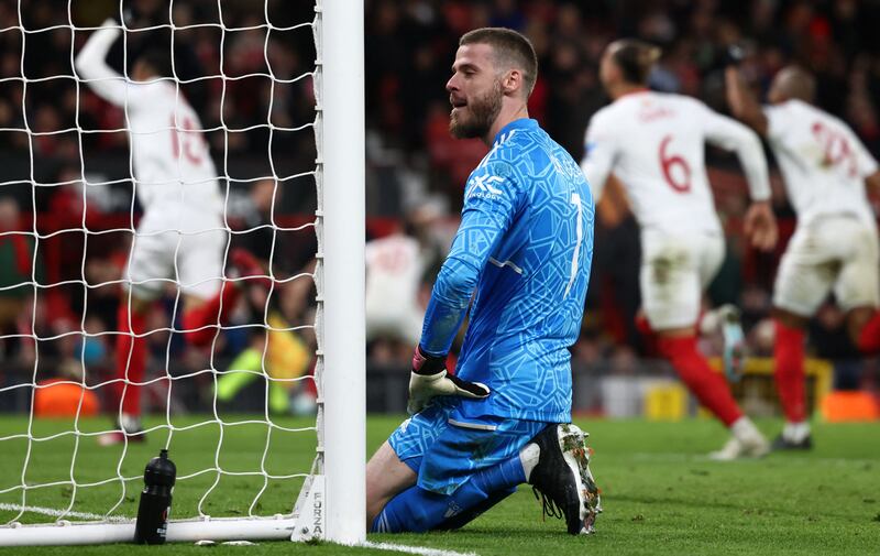 Manchester United's Spanish goalkeeper David de Gea reacts after conceding a second goal during the UEFA Europa league quarter-final, first leg football match between Manchester United and Sevilla at Old Trafford stadium in Manchester, north west England, on April 13, 2023.  (Photo by Darren Staples  /  AFP)