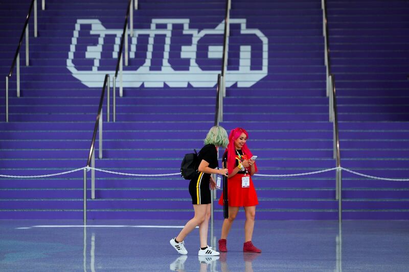 FILE PHOTO: Attendees walk past a Twitch logo painted on stairs during opening day of E3, the annual video games expo revealing the latest in gaming software and hardware in Los Angeles, California, U.S., June 11, 2019.  REUTERS/Mike Blake/File Photo