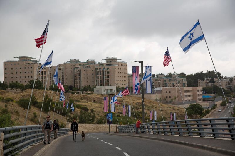 Security officers walk on a road leading to the US Embassy compound ahead the official opening in Jerusalem, Sunday, May 13, 2018. Monday's opening of the U.S. Embassy in contested Jerusalem, cheered by Israelis as a historic validation, is seen by Palestinians as an in-your-face affirmation of pro-Israel bias by President Donald Trump and a new blow to frail statehood dreams. (AP Photo/Ariel Schalit)
