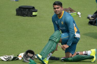 Pakistan's Umar Akmal pads up as he takes part in a training session before the World T20 cricket tournament match at The Eden Gardens Cricket Stadium in Kolkata on March 13, 2016. Umar has been banned from all forms of cricket for three years for failing to report spot-fixing offers, the Pakistan Cricket Board announced on April 27, 2020. Umar, who turns 30 next month, pleaded guilty to not reporting the fixing offers, which led to his provisional suspension on February 20 this year. AFP