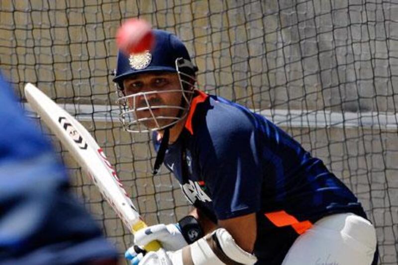 Virender Sehwag bats in the nets during the team's training at the MCG.