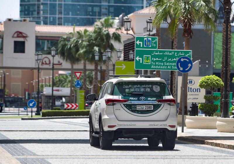 Dubai, United Arab Emirates - Reporter: N/A: Corona. A police car patrols an empty JBR. Tuesday, April 14th, 2020. Dubai. Chris Whiteoak / The National