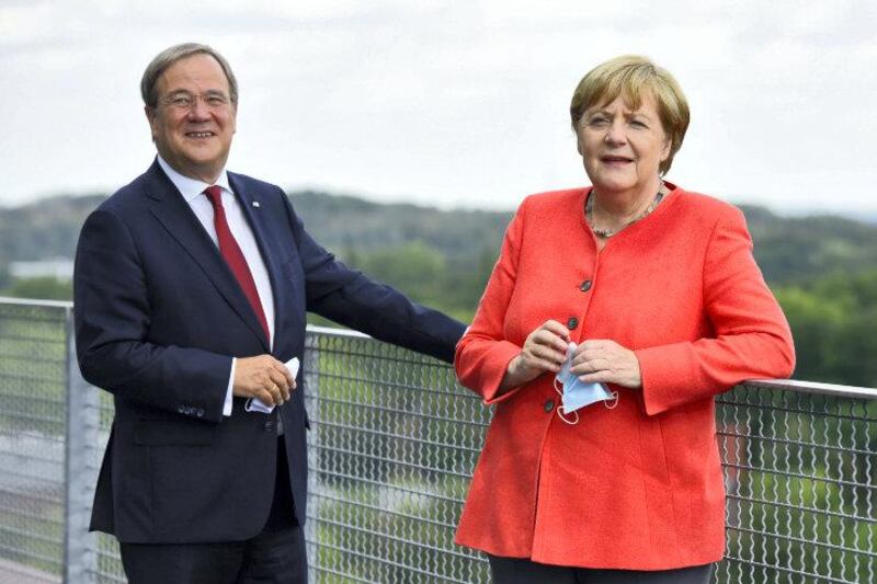 ESSEN, GERMANY - AUGUST 18:  German Chancellor Angela Merkel and North Rhine-Westphalia Governor Armin Laschet visit the Ruhr Conference at the Zeche Zollverein former coal mine and coking plant, today a UNESCO World Heritage site, on August 18, 2020 in Essen, Germany. Merkel attended a North Rhine-Westphalia government cabinet meeting earlier in the day. Laschet is one of three current candidates to succeed Merkel as chancellor candidate for the German Christian Democrats (CDU/CSU).  (Photo by Hauter-Pool/Getty Images)
