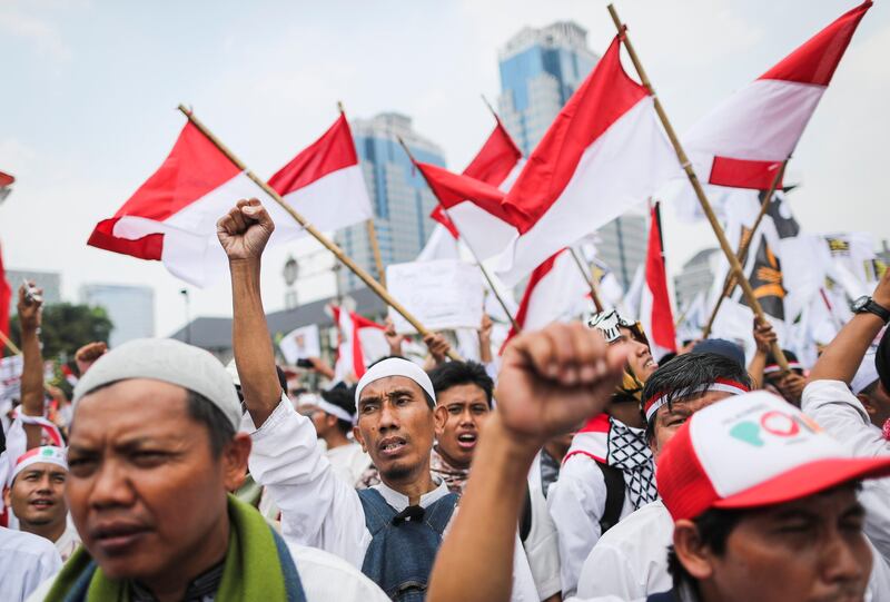 Indonesian Muslim activists shout slogans during a protest against the persecution of the Rohingya minority, in Jakarta, Indonesia. According to the United Nations,  more than 300,000 Rohingya refugees have fled Myanmar from violence over the last few weeks, most trying to cross the border to reach neighboring Bangladesh. Mast Irham / EPA.