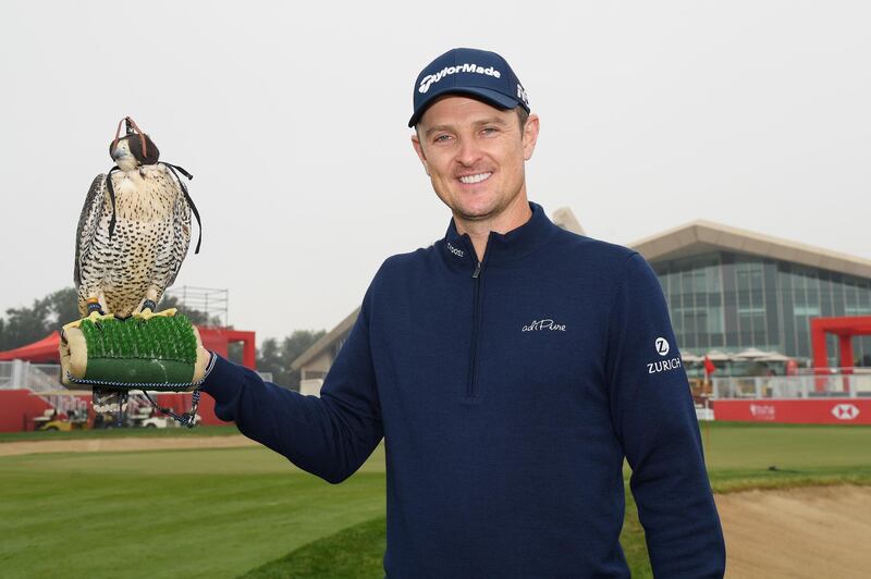 Justin Rose poses with a falcon ahead of the Abu Dhabi HSBC Golf Championship. Ross Kinnaird / Getty Images