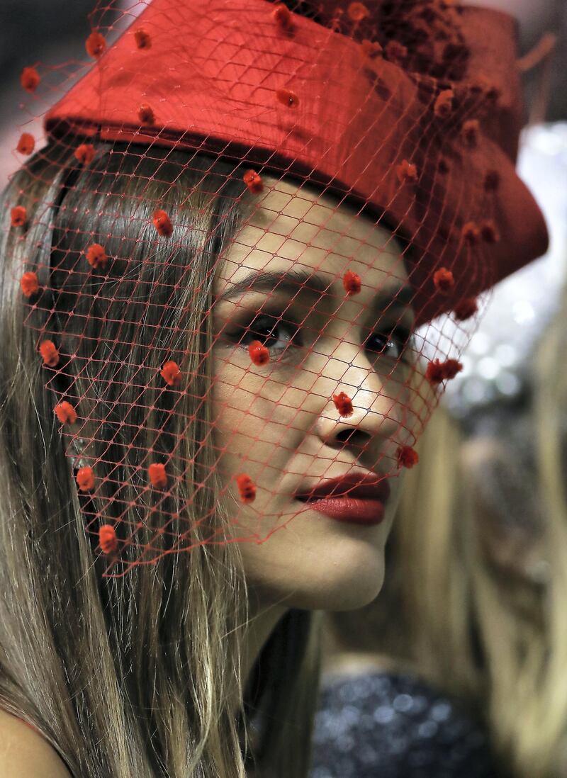 DUBAI , UNITED ARAB EMIRATES , MARCH 30  – 2018 :- One of the guest watching the 7th horse race Dubai Turf 1800m turf  during the Dubai World Cup held at Meydan Racecourse in Dubai. ( Pawan Singh / The National ) For News/Sports/Instagram/Big Picture. Story by Amith/Rupert