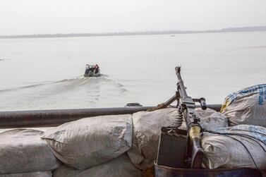 A machine gun mounted on a lookout boat posted to watch for pirates off the Atlantic coast in Nigeria's Bayelsa state. Reuters