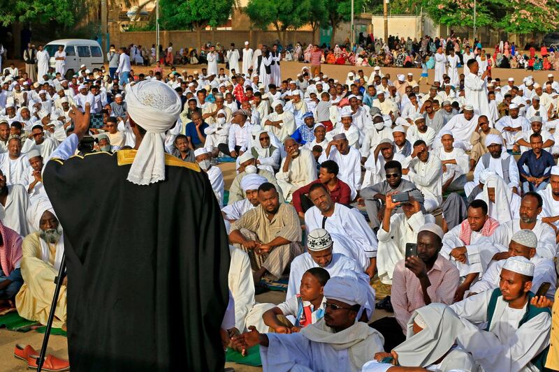 An Imam preaches a sermon to worshippers during Eid Al Fitr prayers in the district of Jureif Gharb of Sudan's capital Khartoum AFP