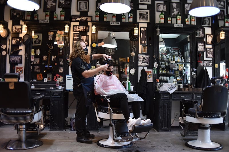A stylist cuts a customer's hair at the barber shop The Barber Job in Buenos Aires, Argentina. Getty Images