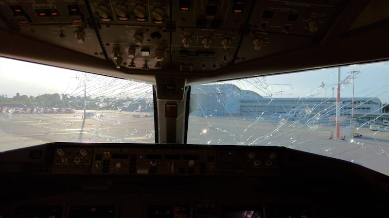 The storm was so strong that hail stones managed to crack the windscreen of the flight deck.