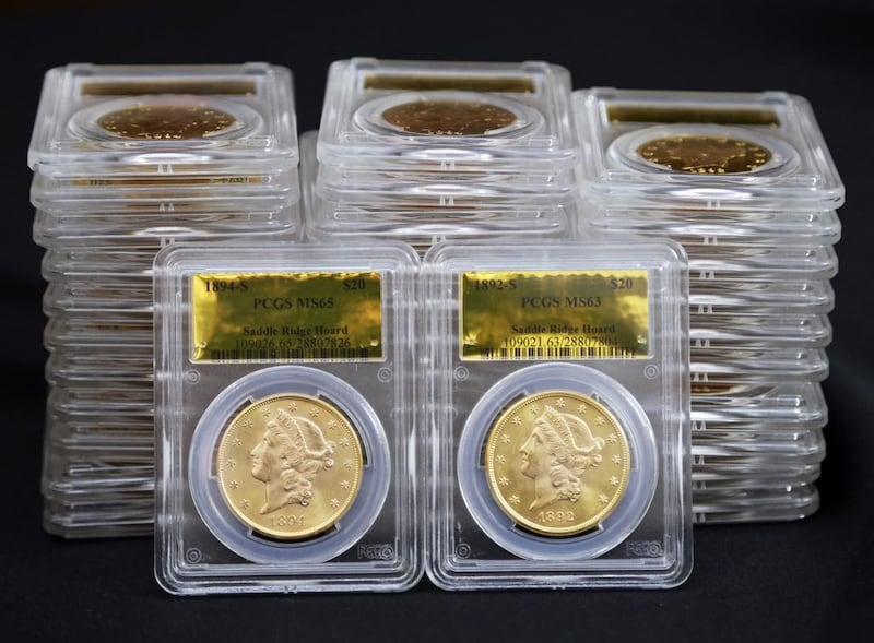Some of 1,427 Gold-Rush era US gold coins are displayed at Professional Coin Grading Service in Santa Ana. Reed Saxon / AP Photo