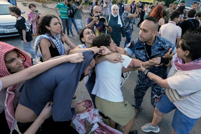 Protesters clash with Lebanese troops and riot police during a demonstration in solidarity with Palestinians in Gaza, near the the Egyptian embassy in Beirut, Lebanon. AP