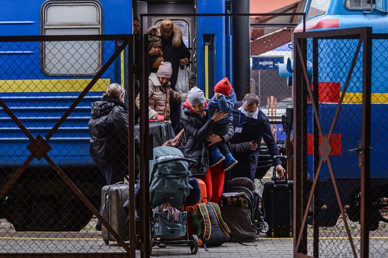 Ukrainians from Odesa fleeing the Russian invasion arrive at the main train station in Przemysl, Poland, on February 25. Getty Images