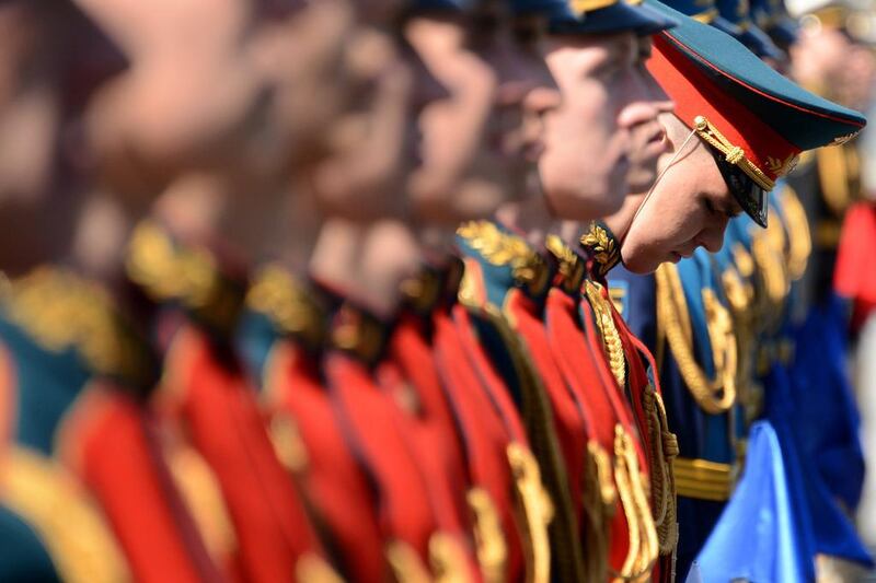 Russian honour guard take part in a wreath-laying ceremony at the Tomb of the Unknown Soldier outside the Kremlin in Moscow. Russia is gearing up for hugely patriotic celebrations of its victory over Nazi Germany in World War II tomorrow, but festivities in neighbouring Ukraine will be muted amid fears of provocations. Kirill Kudryavtsev / AFP Photo