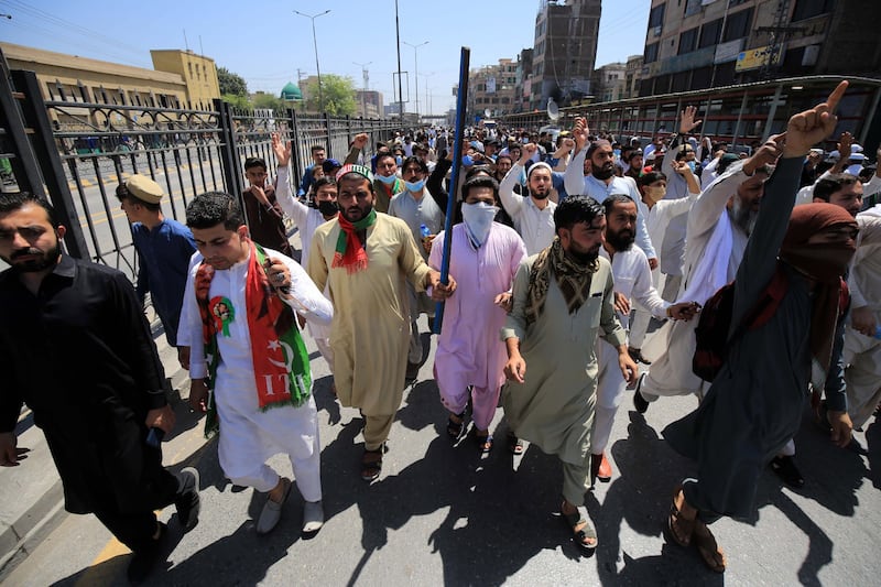 Supporters of Pakistan's former Prime Minister Imran Khan rally following his arrest, in Peshawar, on May 10. EPA