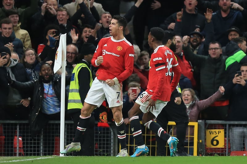 Cristiano Ronaldo celebrates after scoring his and Manchester United's third goal in the 3-2 Premier League win against Tottenham at Old Trafford, 
AFP