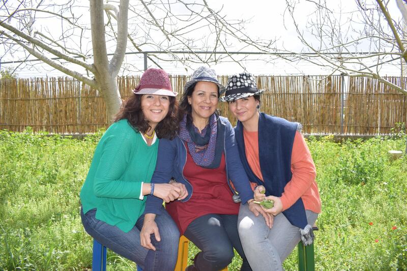 <p>Nancy (left), Gladys (centre) and Nathalie (right) in their garden. Ahmad Ghazzaoui