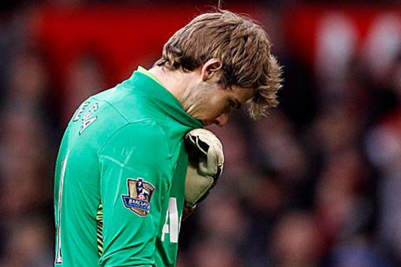 Manchester United's David De Gea reacts after Blackburn Rovers scored their third goal during their English Premier League soccer match at Old Trafford in Manchester, northern England, December 31, 2011. REUTERS/Phil Noble (BRITAIN - Tags: SPORT SOCCER) FOR EDITORIAL USE ONLY. NOT FOR SALE FOR MARKETING OR ADVERTISING CAMPAIGNS. NO USE WITH UNAUTHORIZED AUDIO, VIDEO, DATA, FIXTURE LISTS, CLUB/LEAGUE LOGOS OR "LIVE" SERVICES. ONLINE IN-MATCH USE LIMITED TO 45 IMAGES, NO VIDEO EMULATION. NO USE IN BETTING, GAMES OR SINGLE CLUB/LEAGUE/PLAYER PUBLICATIONS