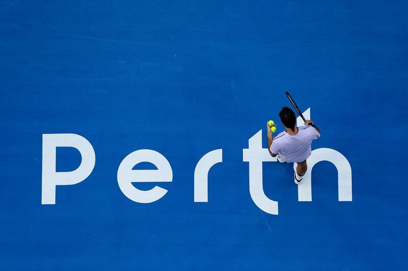 Roger Federer of Switzerland prepares to serve to United States' Jack Sock during the Hopman Cup in Perth, Australia. Will Russell / Getty Images