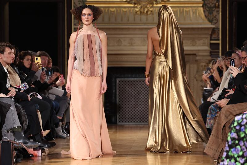 The looks in the Moroccan maison's show were largely in tones of gold, sand and brown. AFP