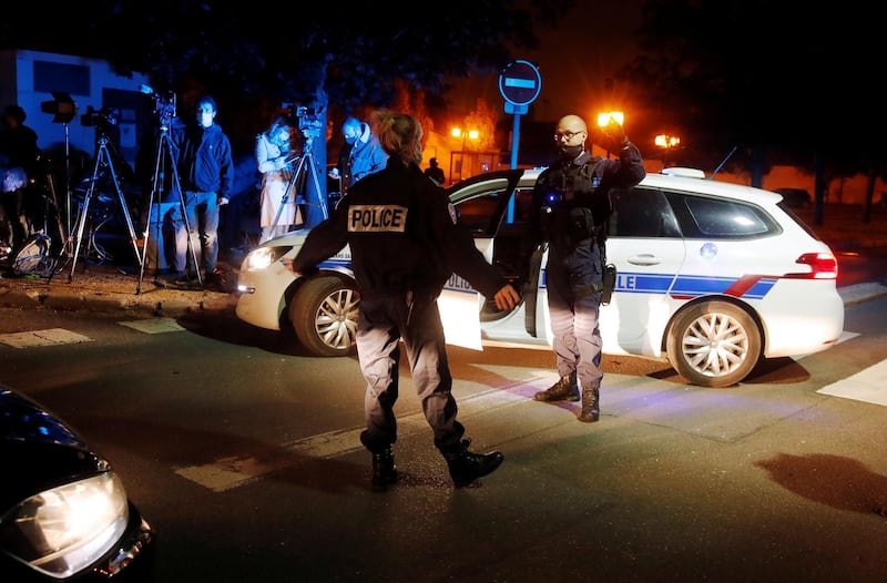 Police officers secure the scene of a stabbing attack in the Paris suburb of Conflans St Honorine. Reuters