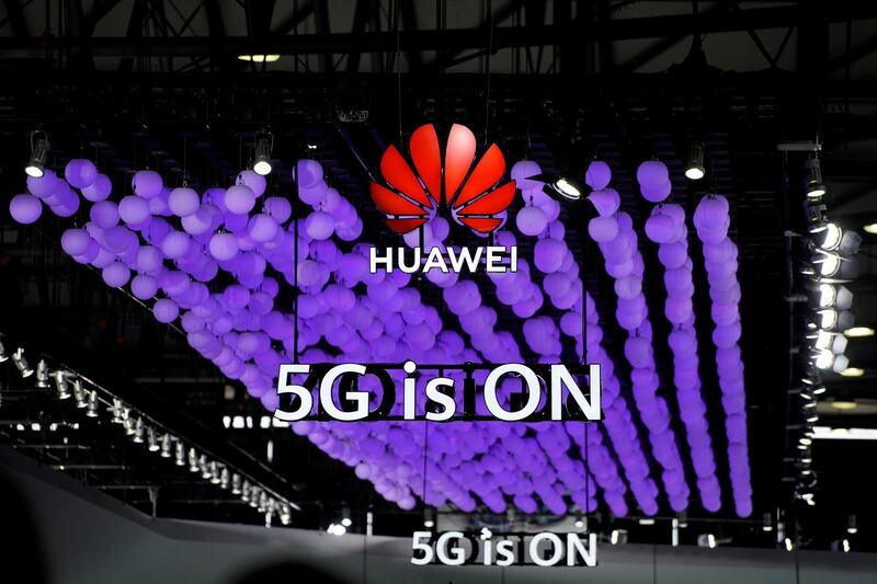 FILE PHOTO: A Huawei logo and a 5G sign are pictured at Mobile World Congress (MWC) in Shanghai, China June 28, 2019. REUTERS/Aly Song/File Photo