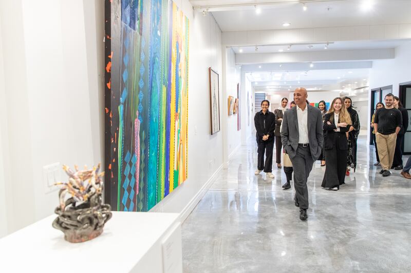 The UAE's ambassador to the US Yousef Al Otaiba looks at some of the artwork on display. All photos: UAE embassy in Washington