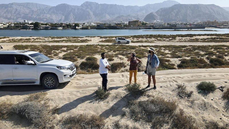 RAK, UNITED ARAB EMIRATES , January 20 – Mohammed (left) with his 4x4  lives near the Pink Lake which discovered in Ras Al Khaimah. Some visitors are coming to see this lake after some pictures appeared on the social media recently. (Pawan Singh / The National) For News/Stock/Online/Instagram/Standalone/Big Picture. Story by Kelly