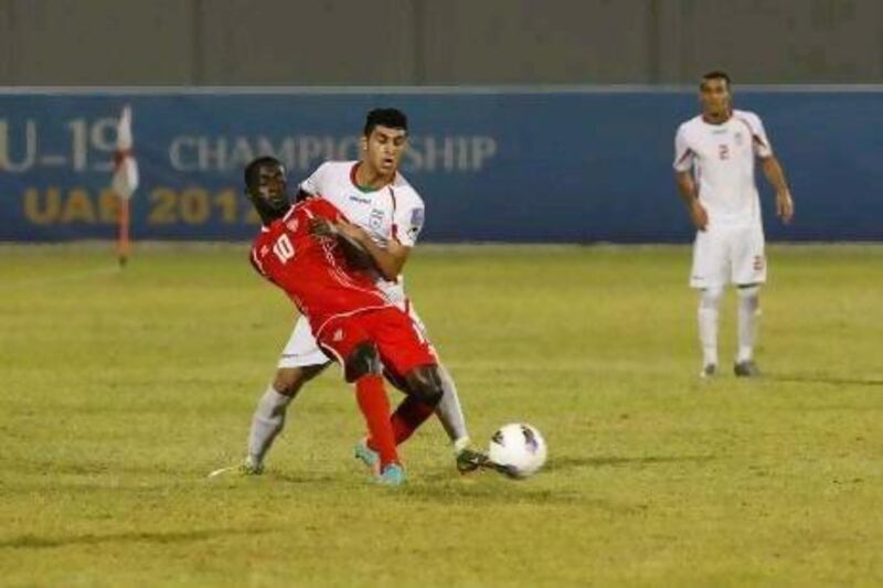 UAE's Ahmed Barman, in red, is put under pressure by Behnam Barzay tonight. The hosts played well but had to come from behind. Jeffrey E Biteng / The National