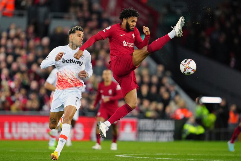 Liverpool defender Joe Gomez attempts to clear the ball. AP