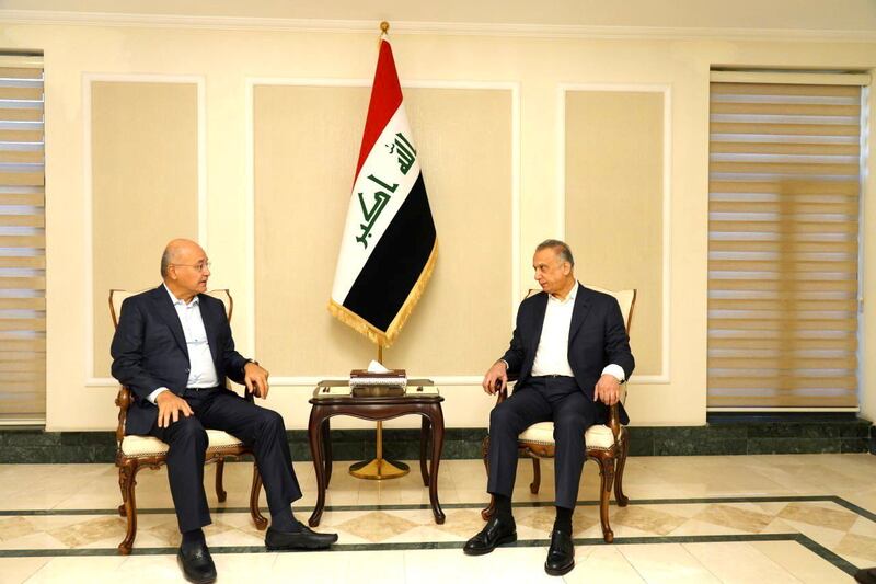 Iraqi Prime Minister Mustafa Al Kadhimi, left, meeting Iraq's President Barham Salih in Baghdad on November 7, 2021. Reuters
