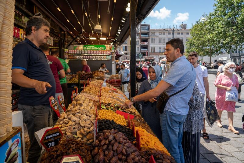 Shoppers at a spice market in Istanbul. Turkey's economy has been battered by high inflation and pressure on the lira. Bloomberg