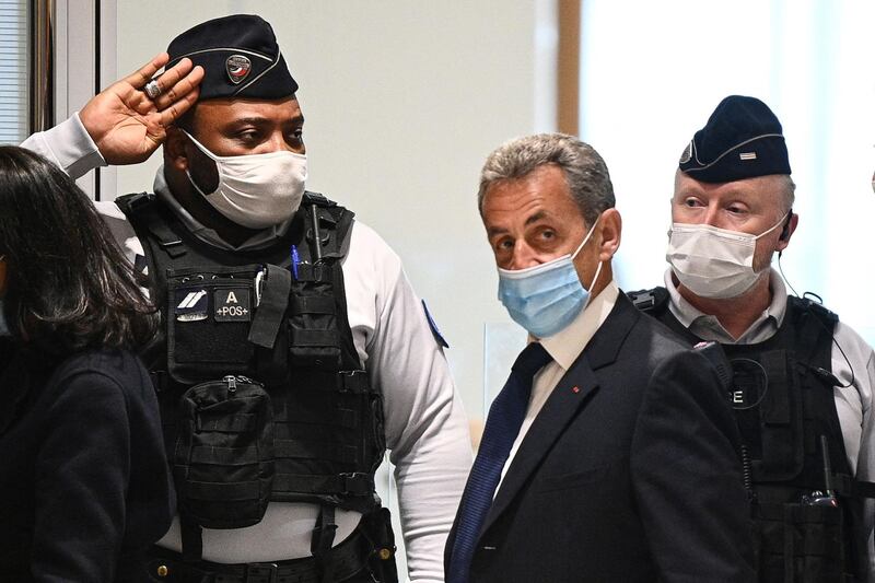 Former French president Nicolas Sarkozy arrives at the Paris court house to hear the final verdict in a corruption trial on March 1, 2021.  A French court is to hand down its verdict in the corruption trial of Sarkozy, with prosecutors demanding prison time for the 66-year-old. Sarkozy, who led France from 2007 to 2012, is accused of offering a plum job in Monaco to a judge in exchange for inside information on an inquiry into his campaign finances.  
 / AFP / Anne-Christine POUJOULAT
