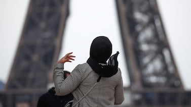 A women wearing a hijab in Paris. In 2004, French authorities banned schoolchildren from wearing 'signs or outfits' which show a religious affiliation. Reuters