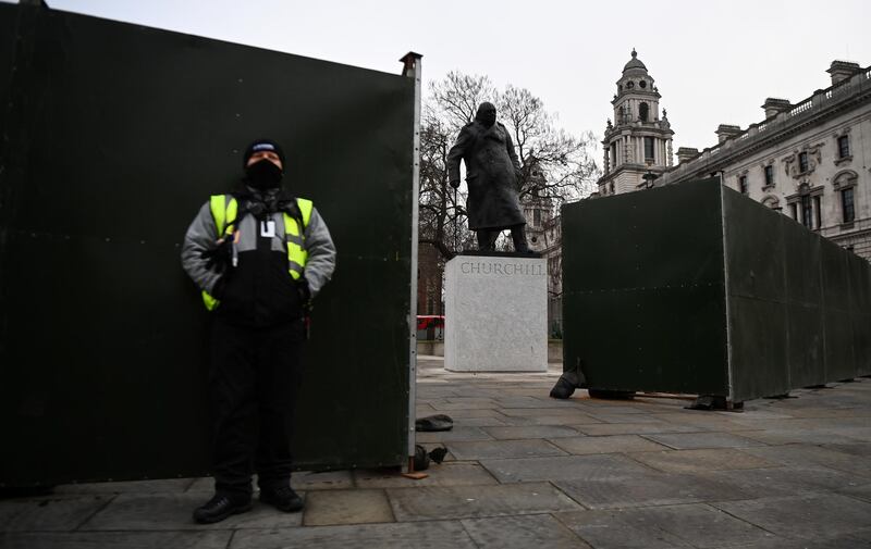 Boarding around Winston Churchill's statue at Parliament Square in London. EPA