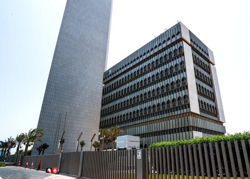 Adnoc's classic old headquarters with the new tower beside it. Victor Besa / The National