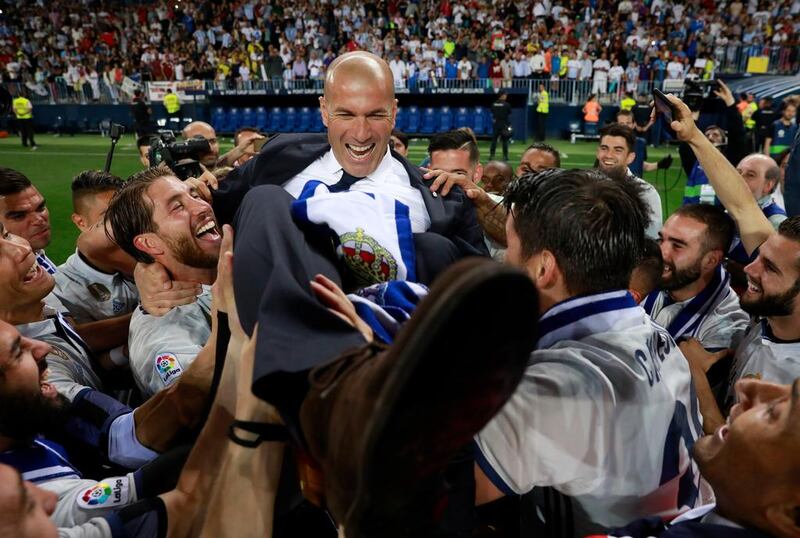 Zinedine Zidane, manager of Real Madrid, celebrates with his players after being crowned champions of Spain. Gonzalo Arroyo Moreno / Getty Images