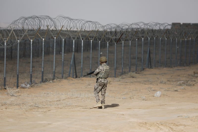 A member of the Iraqi security forces stands guard at the Iraq-Syria border. Reuters