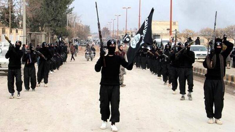 Fighters from ISIL marching in Raqqa, Syria. A new video released on April 19, 2015 shows the group beheading Ethiopian Christians in Libya. AP Photo