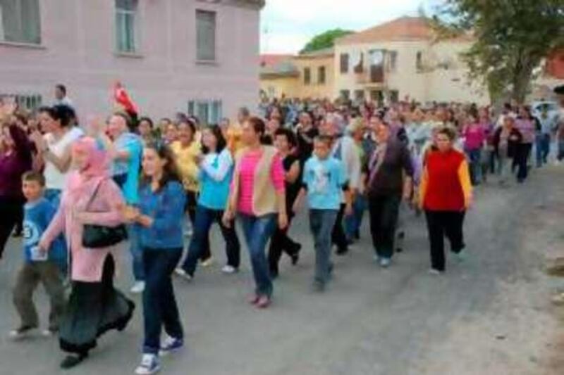 A group of six thousand people demonstrated and shouted slogans against the terrorist organisation (meaning the Kurdish rebel group PKK) in the town of Altinova in the Ayvalik district of the province of Balikesir, where two people died and five were injured as a result of a fight between two groups."

Credit: EMRAH ELMAS/ANADOLU AJANSI



IKI GRUP ARASINDA CIKAN, 2 KISININ OLUMU, 5 KISININ YARALANMASIYLA SONUCLANAN KAVGANIN YASANDIGI BALIKESIR'IN AYVALIK ILCESI ALTINOVA BELDESINDE, YAKLASIK 6 BIN KISILIK GRUP, TEROR ORGUTU ?ALEYHINE SLOGANLAR ATARAK YURUYUS YAPTI. (ANADOLU AJANSI - EMRAH ELMAS) (20081002) 