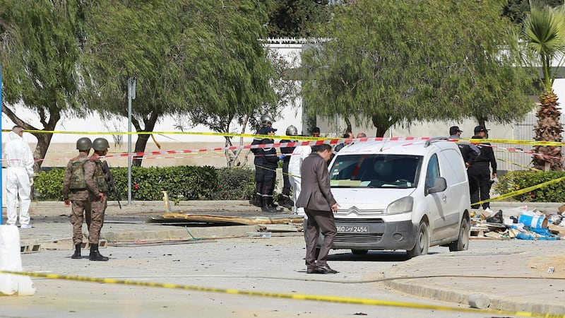 Police and forensic experts inspect the scene of an explosion near the US embassy in the Tunisian capital Tunis.  AFP