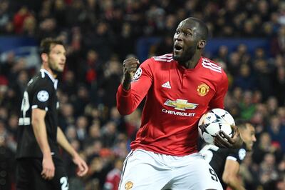 TOPSHOT - Manchester United's Belgian striker Romelu Lukaku celebrates after scoring during a last 16 second leg UEFA Champions League football match between Manchester United and Sevilla at Old Trafford in Manchester, northwest England on March 13, 2018. / AFP PHOTO / Oli SCARFF