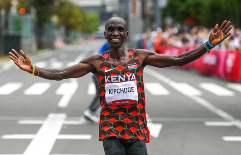 Eliud Kipchoge of Kenya celebrates after winning the men's marathon.