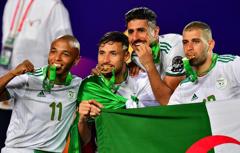 Yacine Brahimi, Youcef Belaili, Baghdad Bounedjah and Sofiane Feghouli celebrate Algeria's win. AFP