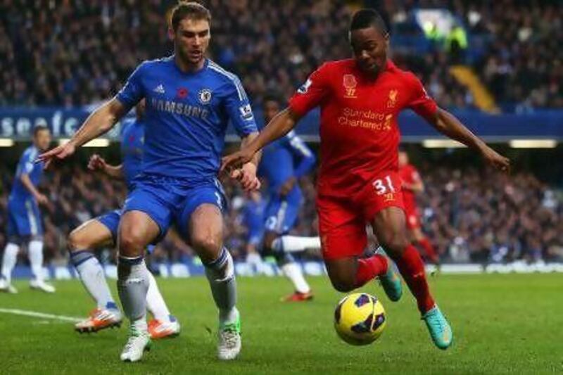 Raheem Sterling, right, the 17-year-old winger, has firmly established himself in the Liverpool starting line-up this season. Clive Rose / Getty Images