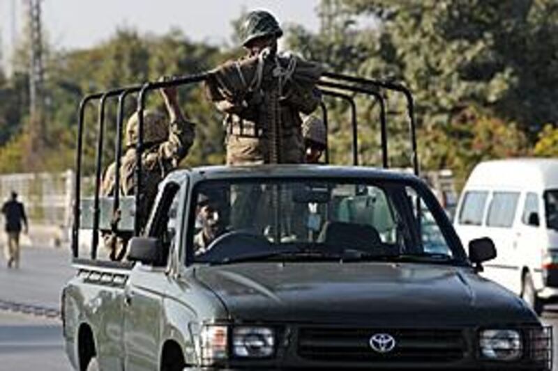 Pakistani soldiers patrol outside the mosque in Pakistan's garrison city, Rawalpindi.