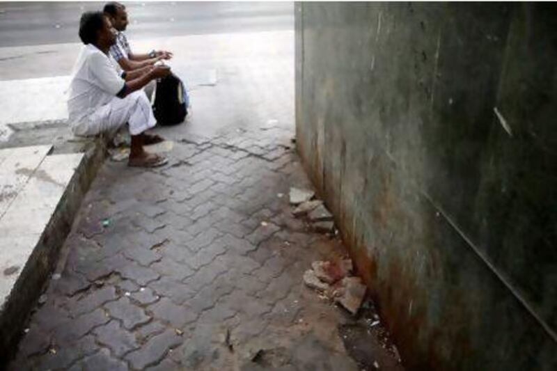 Workers need special chemicals to clean spent paan from building walls and pavements, such as this badly-marked block on Zayed the 1st Street in Abu Dhabi.