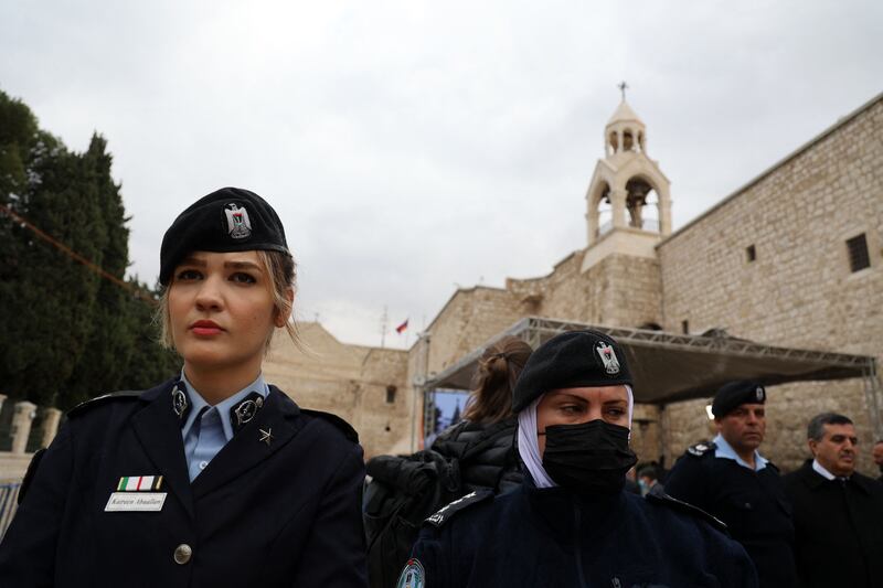 Palestinian security personnel gather in front of the Church of the Nativity. AFP