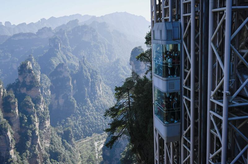 Tourist take the Bailong Elevators in Zhangjiajie. AFP