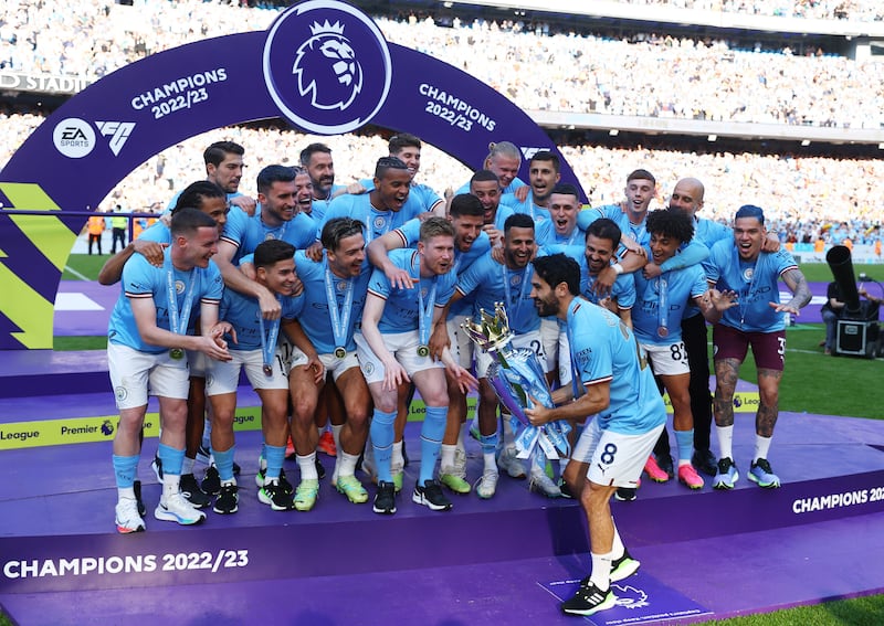 Manchester City captain Ilkay Gundogan celebrates with teammates. Reuters